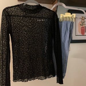 Sheer, Cheetah print turtle neck. Size S.